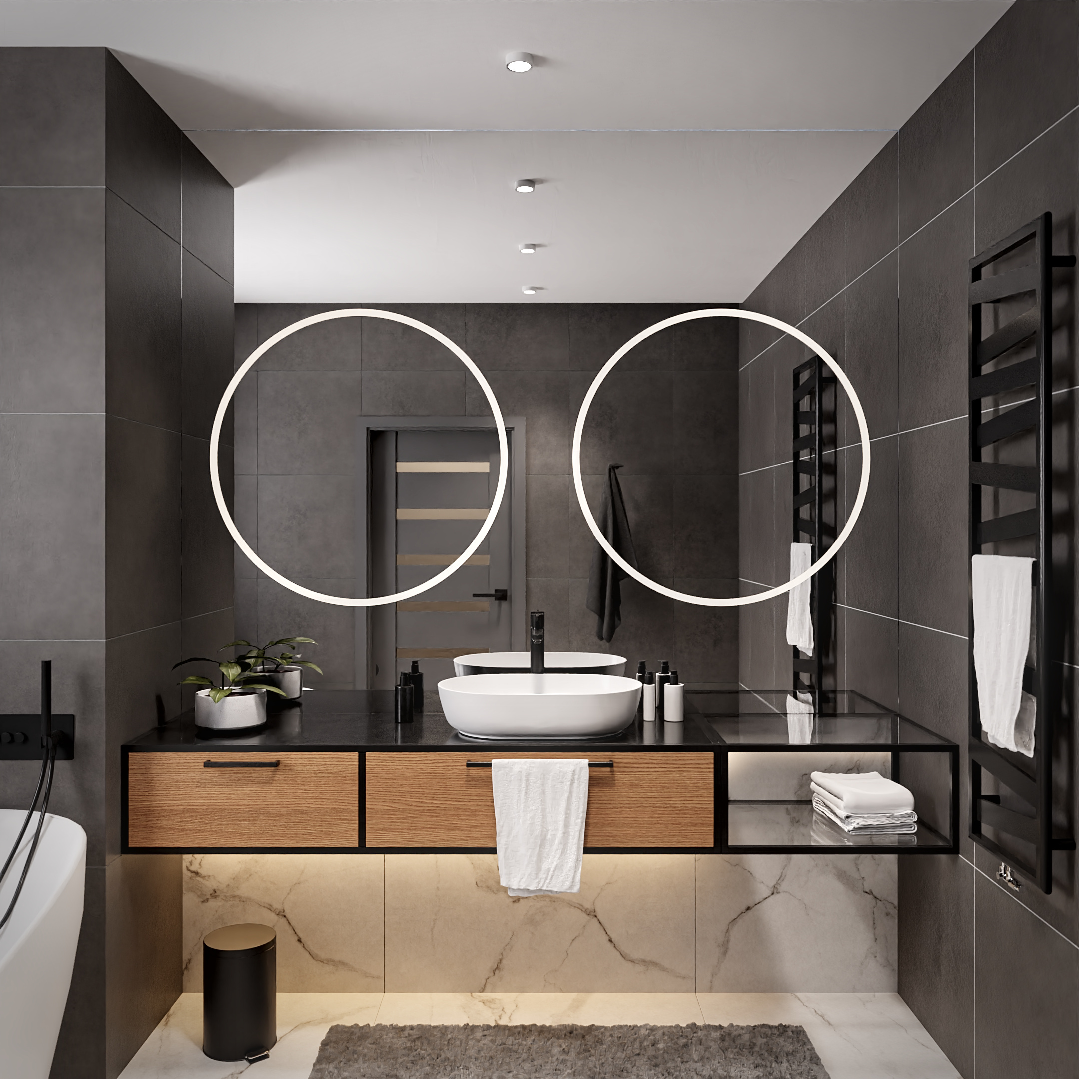 Dwa duże okrągłe lustra w łazience